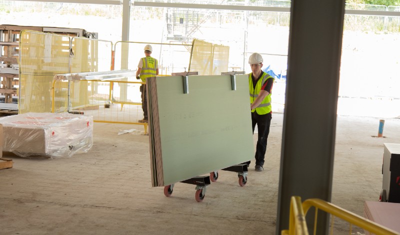 Carry plasterboard hire London - plasterboard carrier used on a construction site